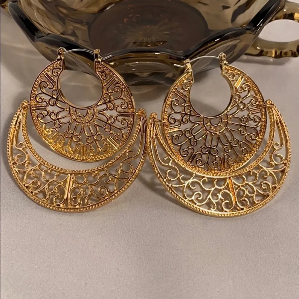 Large gold colored earrings